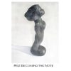 A black sculpture of a person standing on top of a white surface.