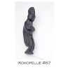 A black sculpture of a man with long hair.
